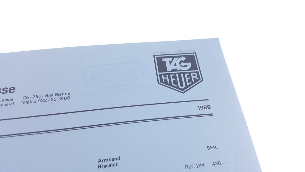 Liste de prix Tag HEUER de 1988 pour le marché Suisse --- couverture détail logo --- ikonicstopwatch.com